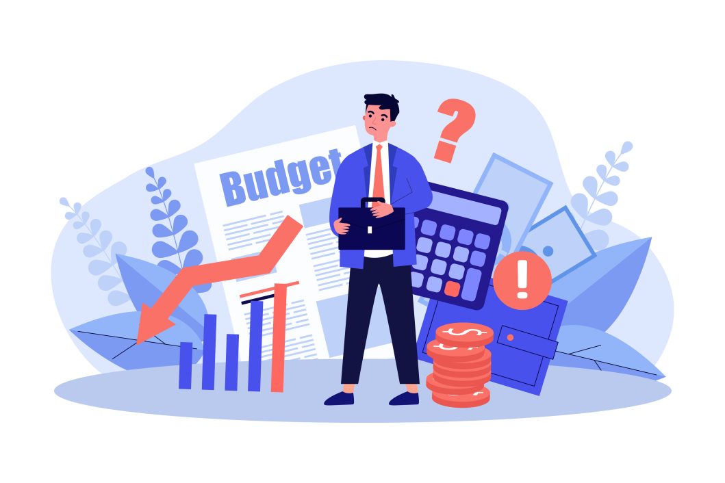 Businessman holding briefcase surrounded by budget documents, declining graph, calculator, and coins.