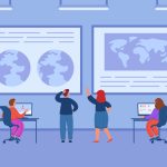 People analyzing maps and data on large screens and computers in office setting.