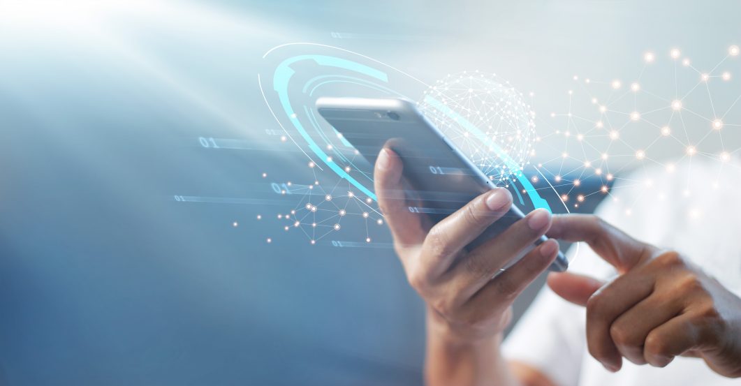 Hands using smartphone with digital connections and binary code overlay on blue gradient background.